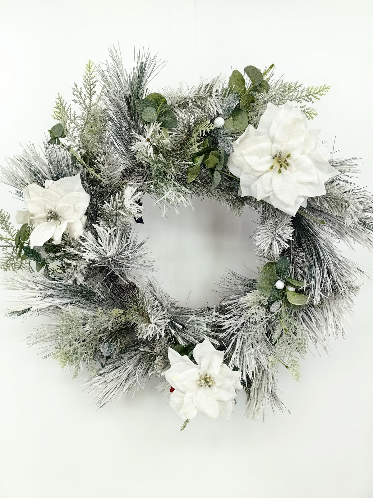 24" long snow needle pine wreath with poisettia flowers 24" long snow needle pine wreath with poisettia flowers