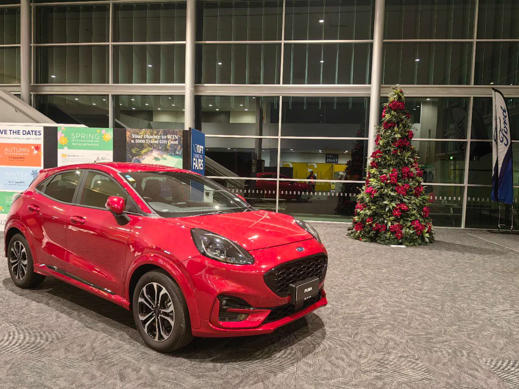 12‘ metal frame green christmas tree with poinsettia & fern decorations 12‘ metal frame green christmas tree with poinsettia & fern decorations